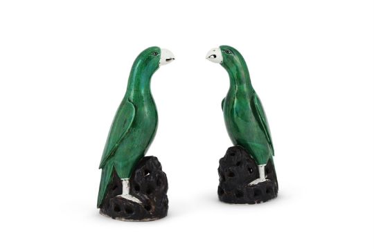 A large pair of Chinese biscuit green-glazed parrots