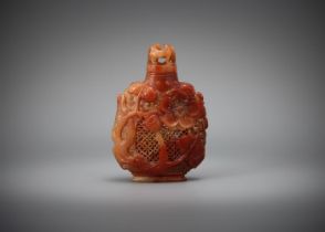 A carved Chinese soapstone snuff bottle