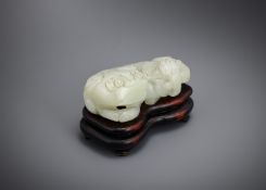 A Chinese pale celadon or white jade lion