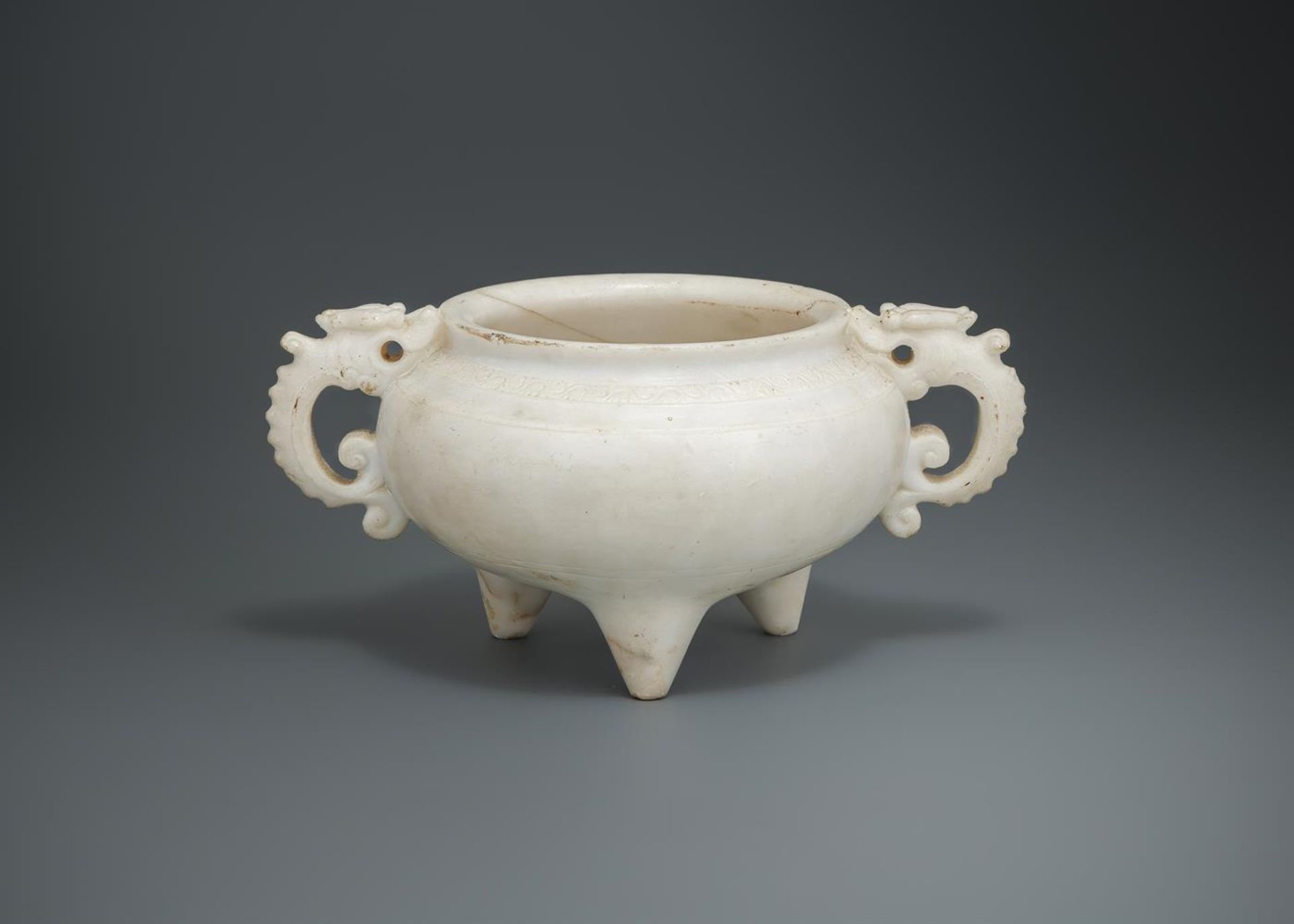 A Chinese carved marble tripod censer
