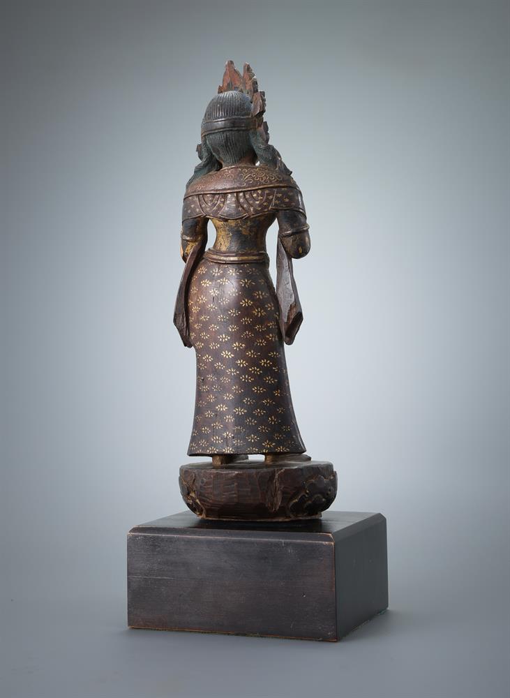 A carved wood parcel-gilt figure of a female deity - Image 3 of 3