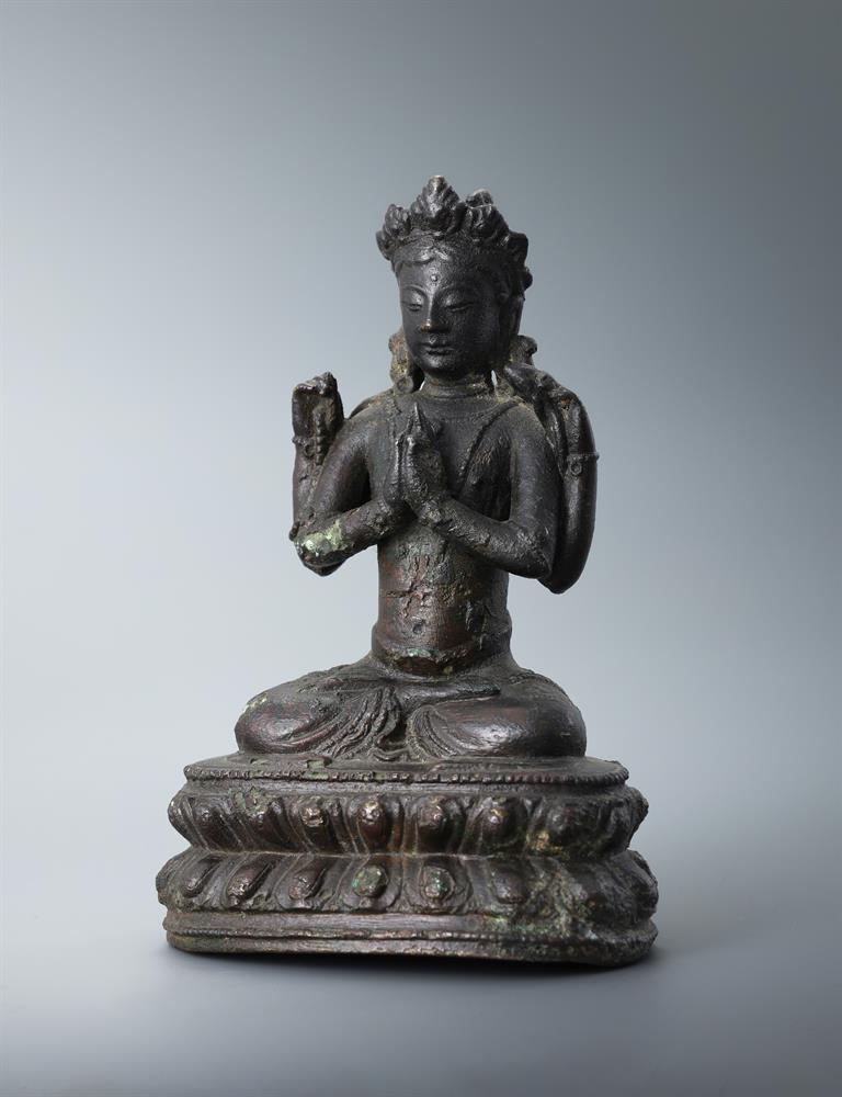 A Sino-Tibetan bronze seated Buddha