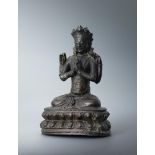 A Sino-Tibetan bronze seated Buddha