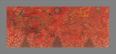 A Chinese red ground silk brocade 'Dragon' panel