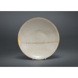 A Chinese Ding white glazed shallow bowl