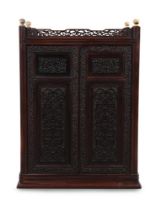 A small Chinese hongmu carved cabinet