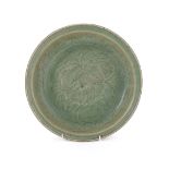 A Chinese carved celadon dish