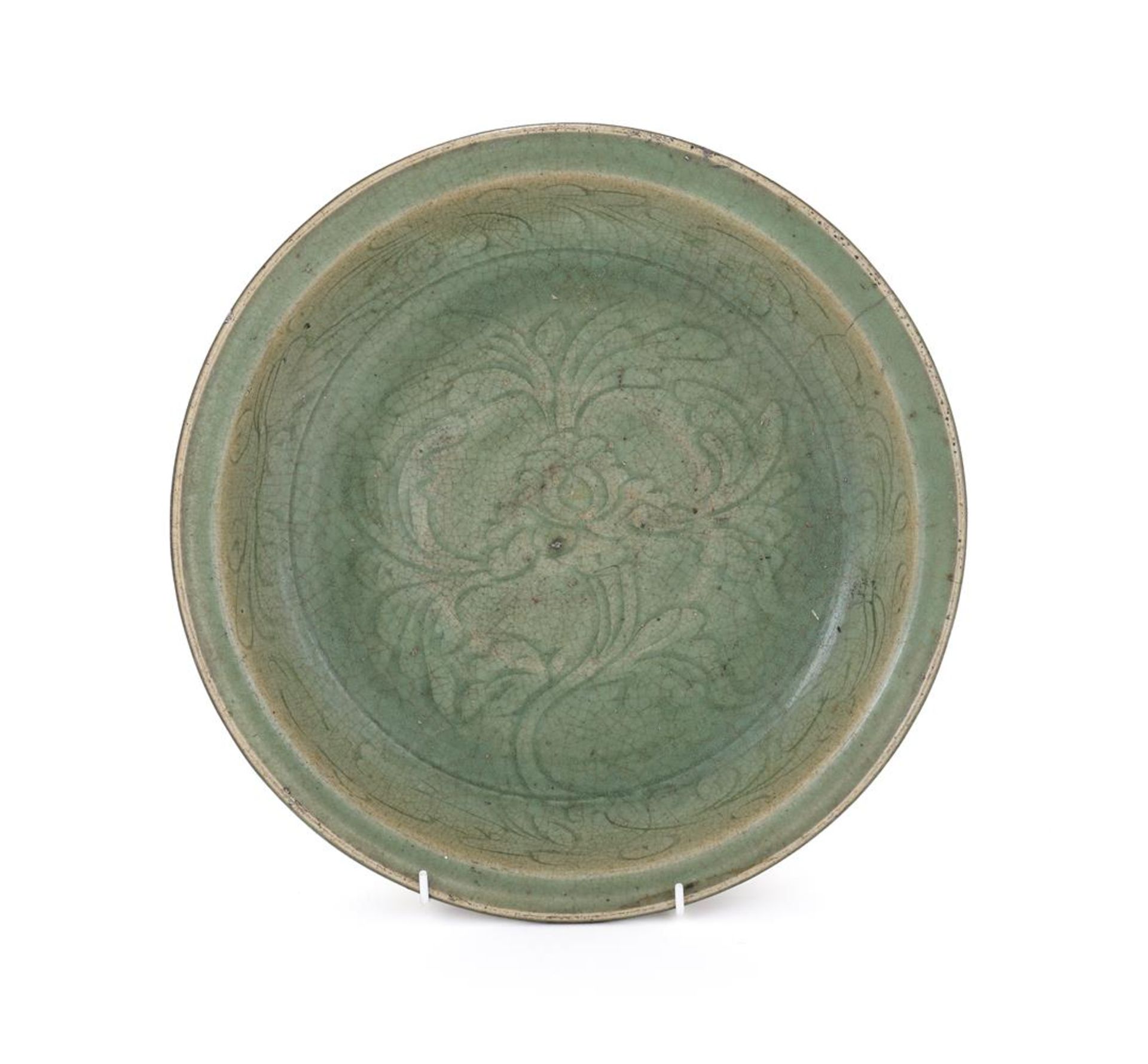 A Chinese carved celadon dish