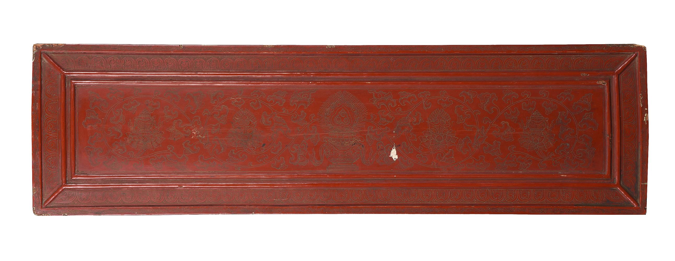 A Tibetan incised red lacquer wood book cover
