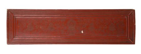 A Tibetan incised red lacquer wood book cover