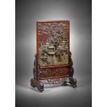 A Chinese Qiyang soapstone 'landscape' table screen