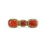 A Chinese gilt-bronze mounted carnelian agate buckle