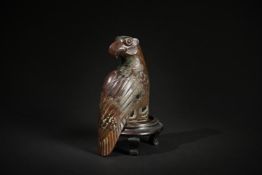 A Chinese bronze model of an eagle