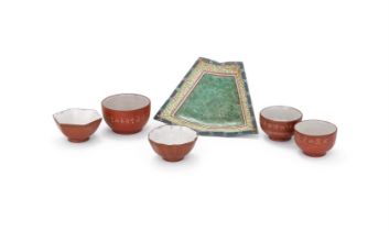 A group of Chinese Yixing tea cups and one sectioned Yixing enamelled plate