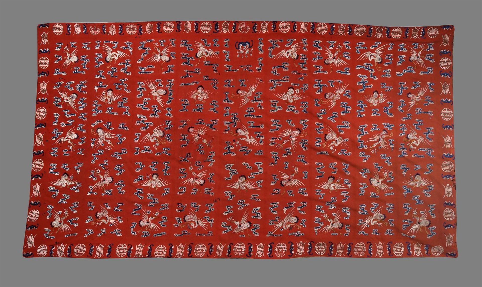 A large Chinese red velvet 'Longevity' wall hanging