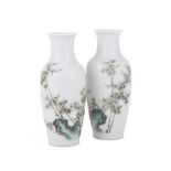 A pair of Chinese enamelled small vases