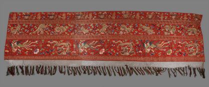 A large Chiense red-ground 'Dragons and phoenixes' wall hanging