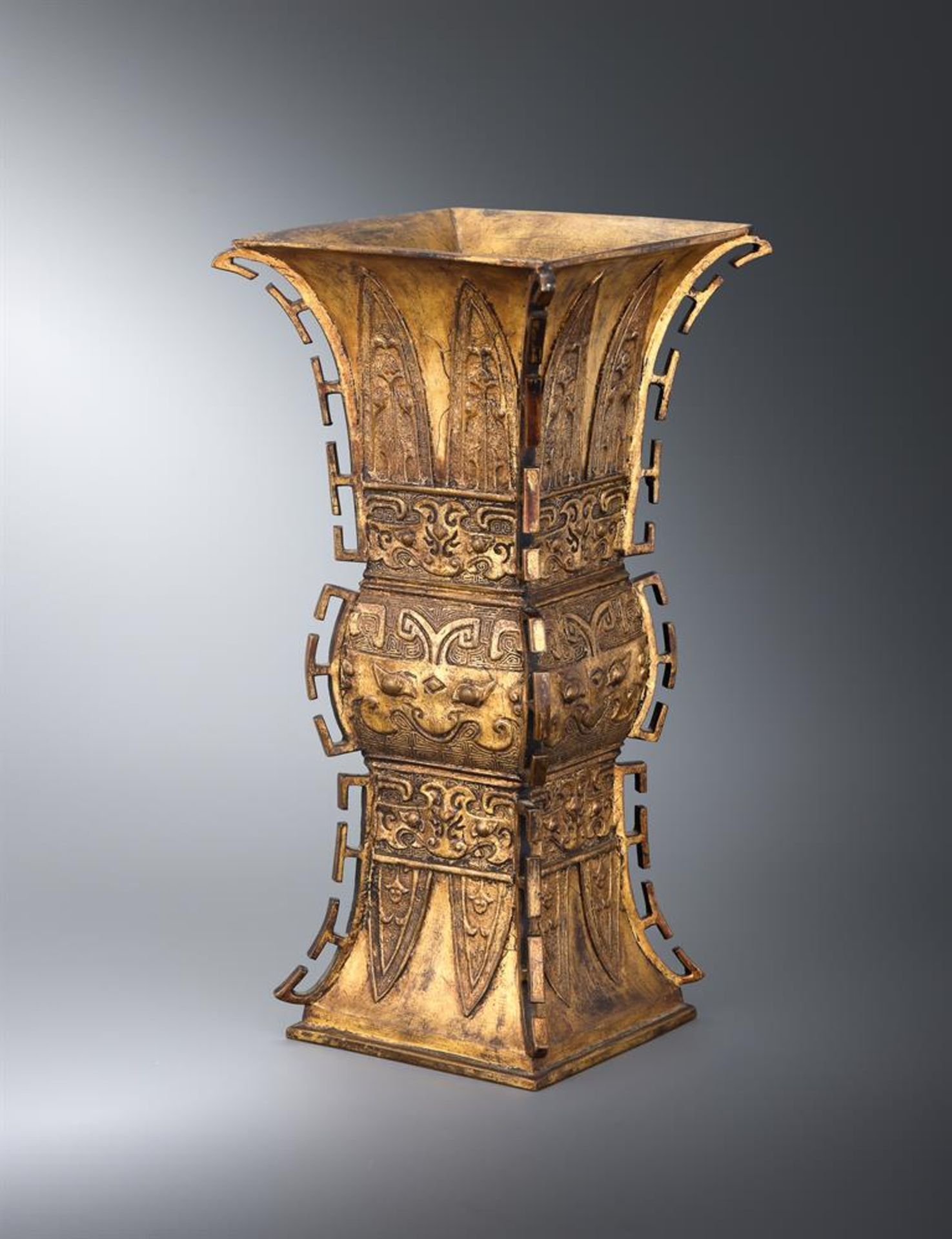 † A Chinese gilt bronze Gu-shaped vase