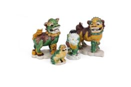 Two Chinese sancai-glazed biscuit models of Buddhistic lions