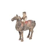A Chinese painted pottery horse and rider