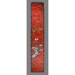 A Chinese red silk wall panel