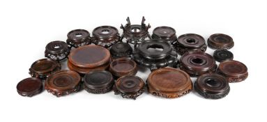† A group of twenty-one Chinese circular hardwood stands