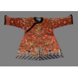 A Chinese silk embroidered Child's red dragon celebration robe