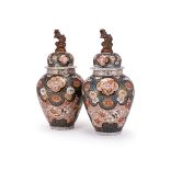 A large pair of Samson or Continental Imari vases and covers