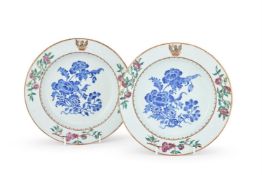 A pair of Chinese Export Famille Rose crested soup bowls