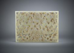A Chinese pale celadon 'Dragon' openwork plaque