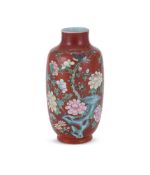 A Chinese coral-ground Famille Rose vase
