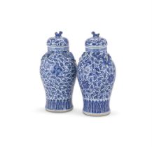 A pair of Chinese blue and white vases and covers