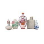 A group of assorted Chinese snuff bottles and one miniature porcelain figure