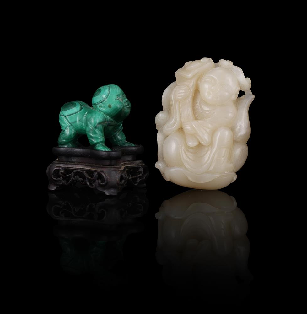 A Chinese celadon jade carving of a boy