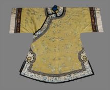 A Chinese yellow silk Manchu woman's informal robe