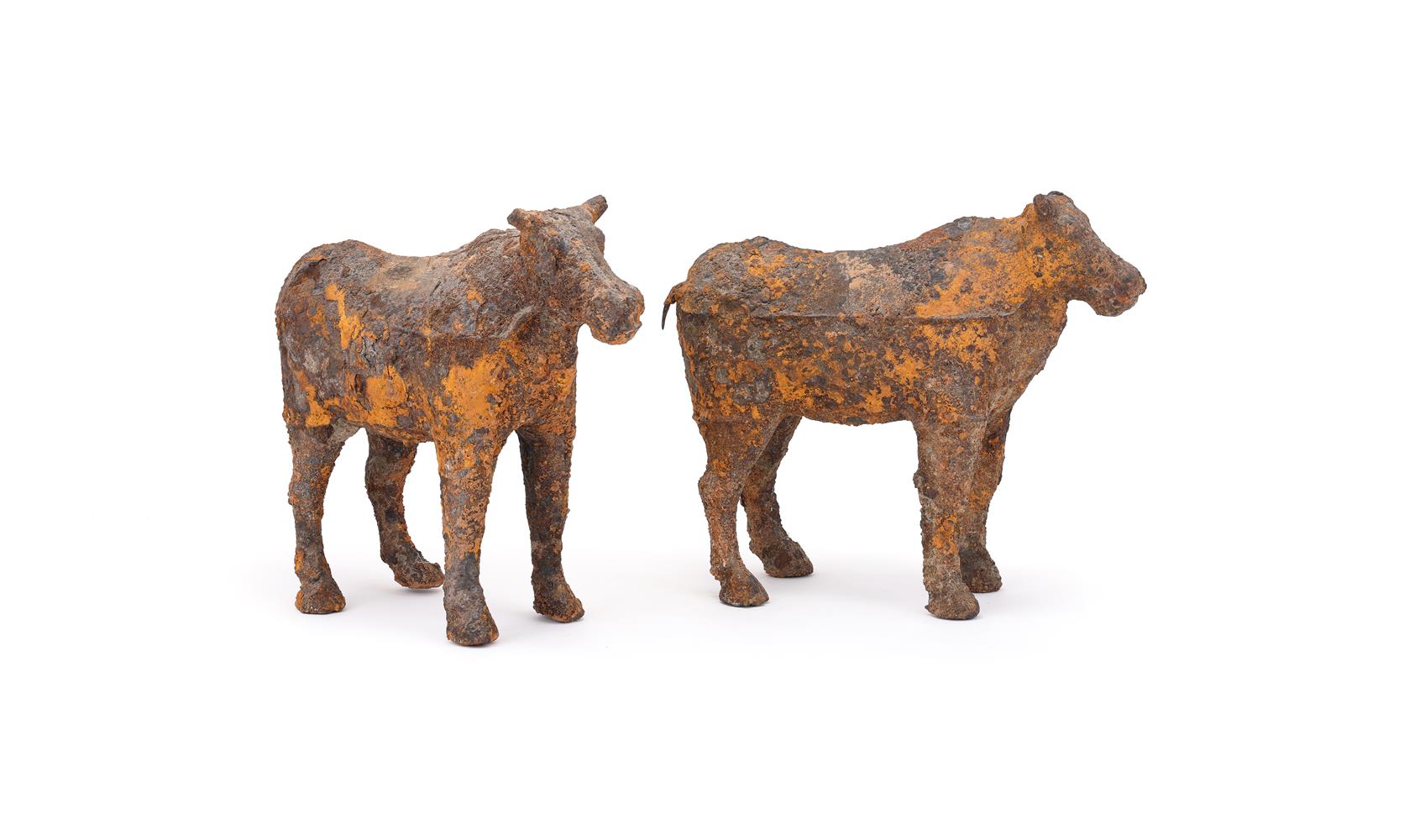 A pair of Chinese iron models of oxen