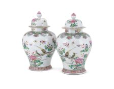 A large pair of Chinese Famille Rose vases and covers