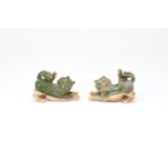 A pair of Chinese green glazed models of lions