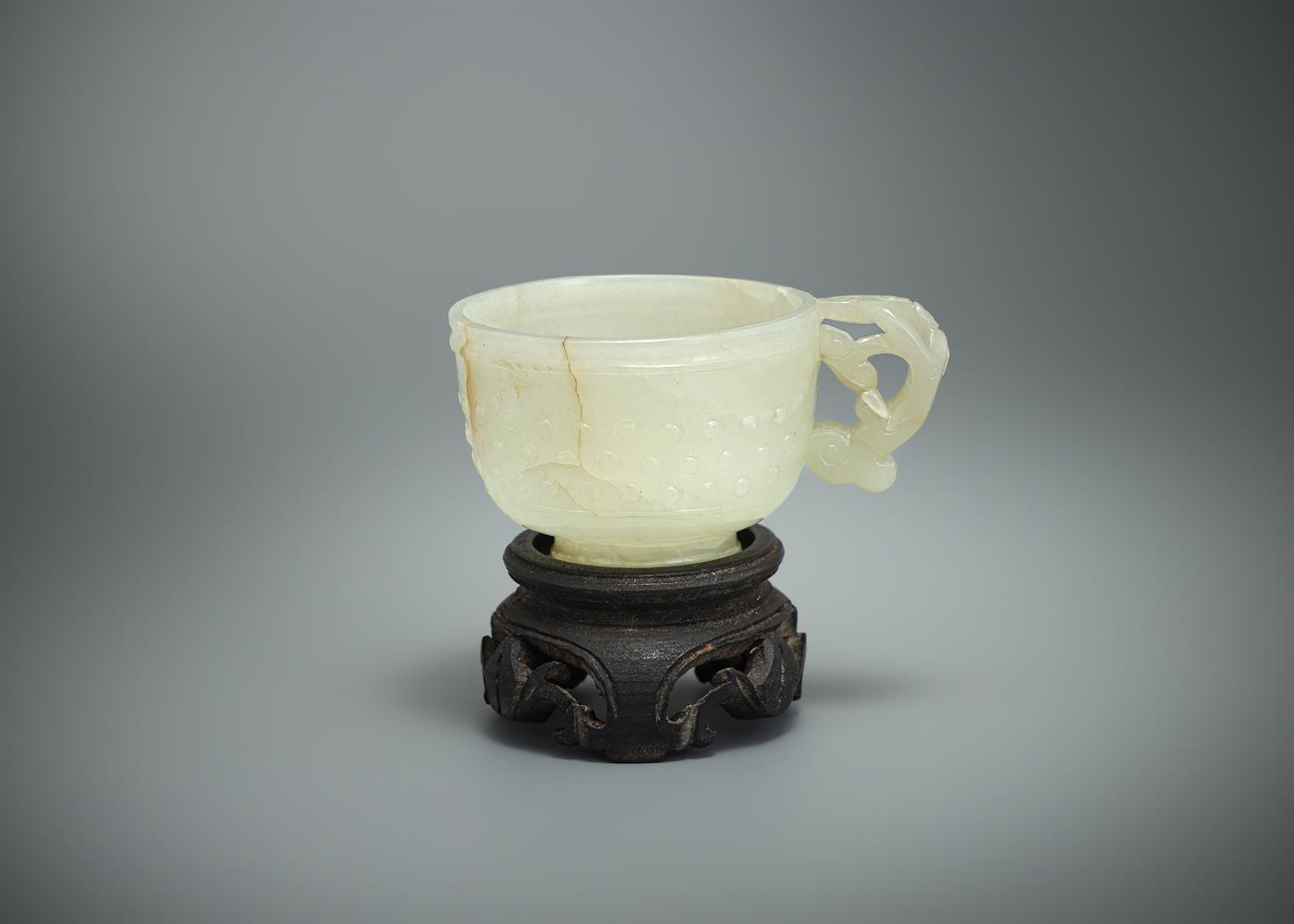 A Chinese pale celadon jade 'Dragon' cup