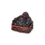 A Chinese resin model of a seated Buddha