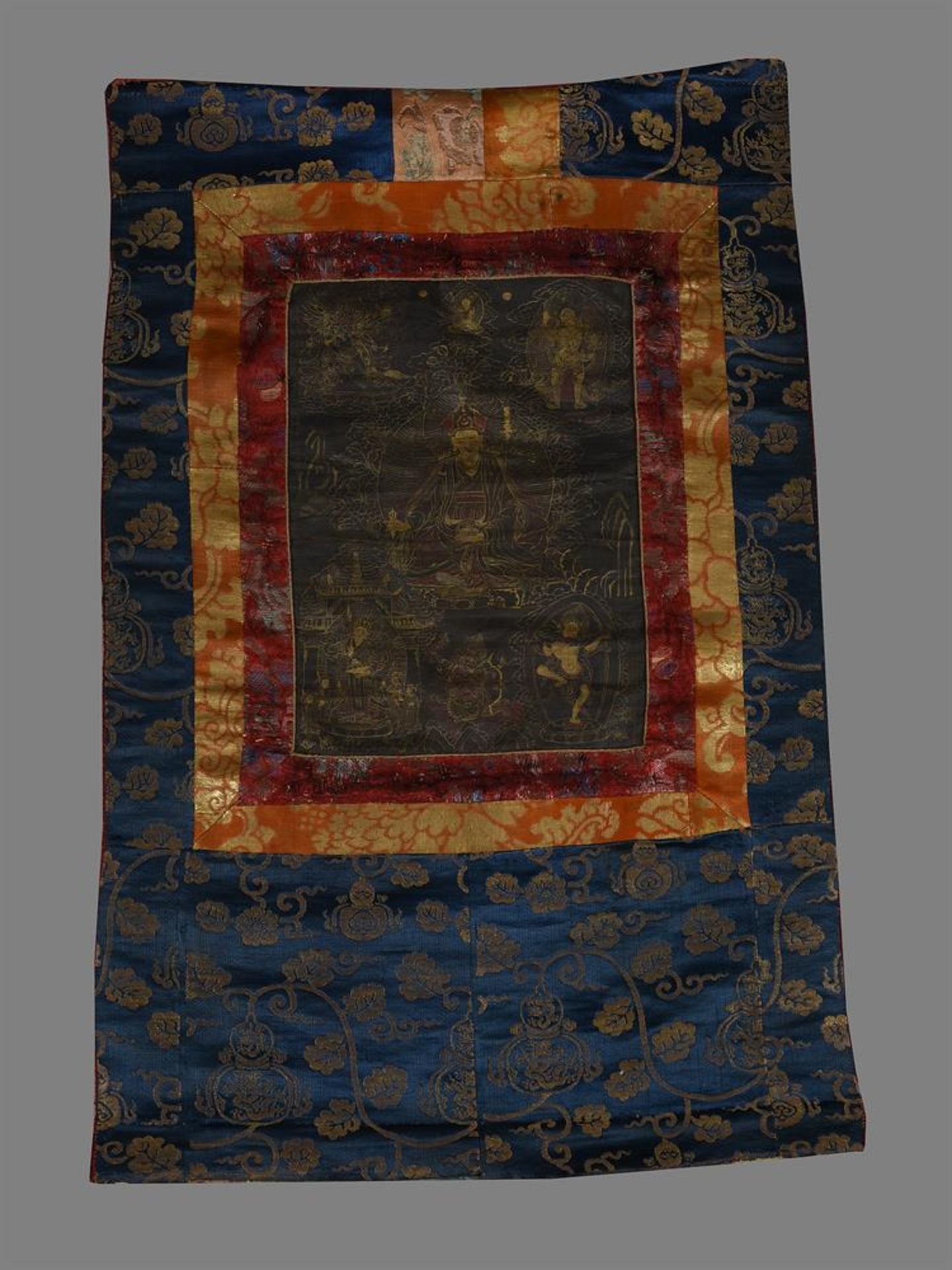 A small Tibetan black ground Thang-ka depicting Padmasambhava (Guru Rinpoche)