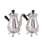 AN EDWARDIAN PAIR OF SILVER CAFE AU LAIT POTS