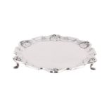 AN EDWARDIAN SILVER SHAPED CIRCULAR SALVER