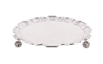 A SILVER SHAPED CIRCULAR SALVER