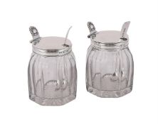 A PAIR OF VICTORIAN SILVER MOUNTED AND GLASS MUSTARD POTS