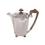 A SILVER OCTAGONAL HOT WATER POT