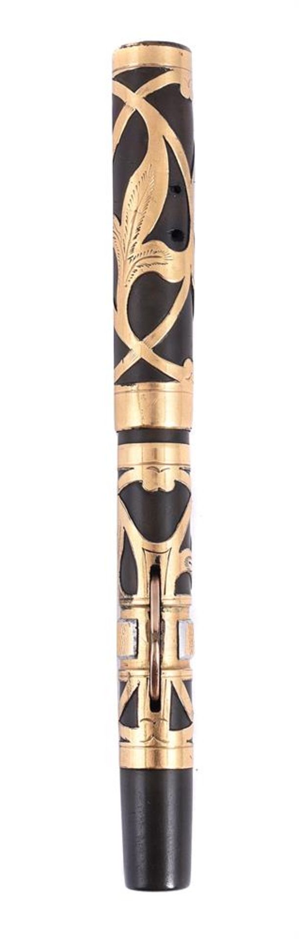 CONKLIN, A BROWN FOUNTAIN PEN WITH GOLD COLOURED OVERLAY