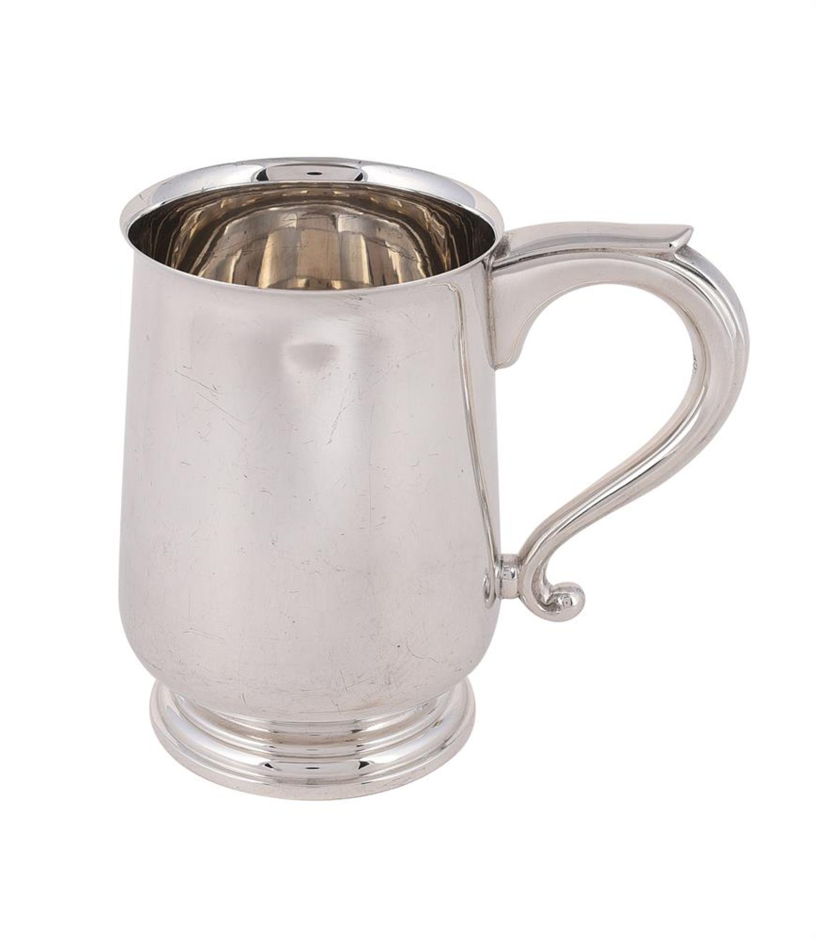 A SILVER BALUSTER MUG