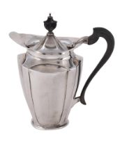 AN EDWARDIAN SILVER OVAL TAPERING HOT WATER POT