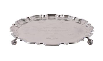 A SILVER SHAPED CIRCULAR SALVER